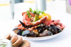 Assorted seafood platter with shrimp, mussels, crab, and lobster